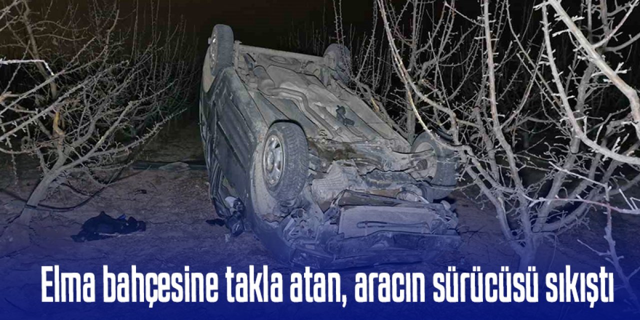 Hafif ticari araç elma bahçesine takla attı, sürücü araç içinde sıkıştı